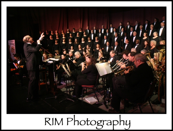 Minister of Music and Worship Rick McCollum directs the orchestra and 100-member choir during the finale.